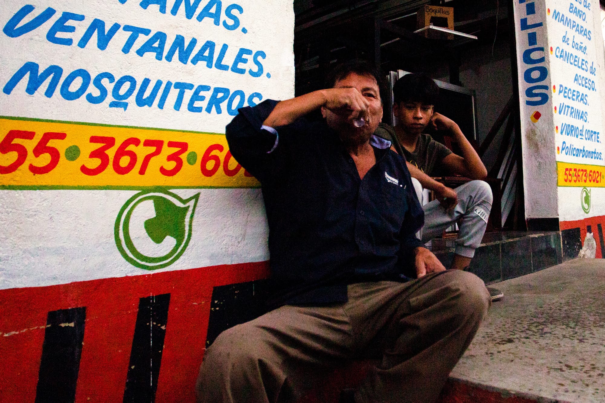 Man drinking mezcal during a Christmas fiesta in Tepooztlán