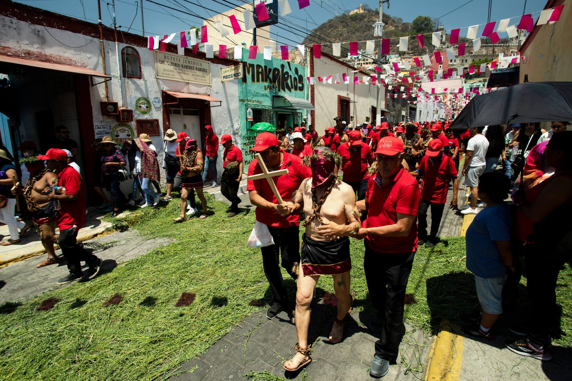 Los Engrillados of Atlixco: Mexican men in shackles with cacti stuck in their skin walk in pain to wash away their sins