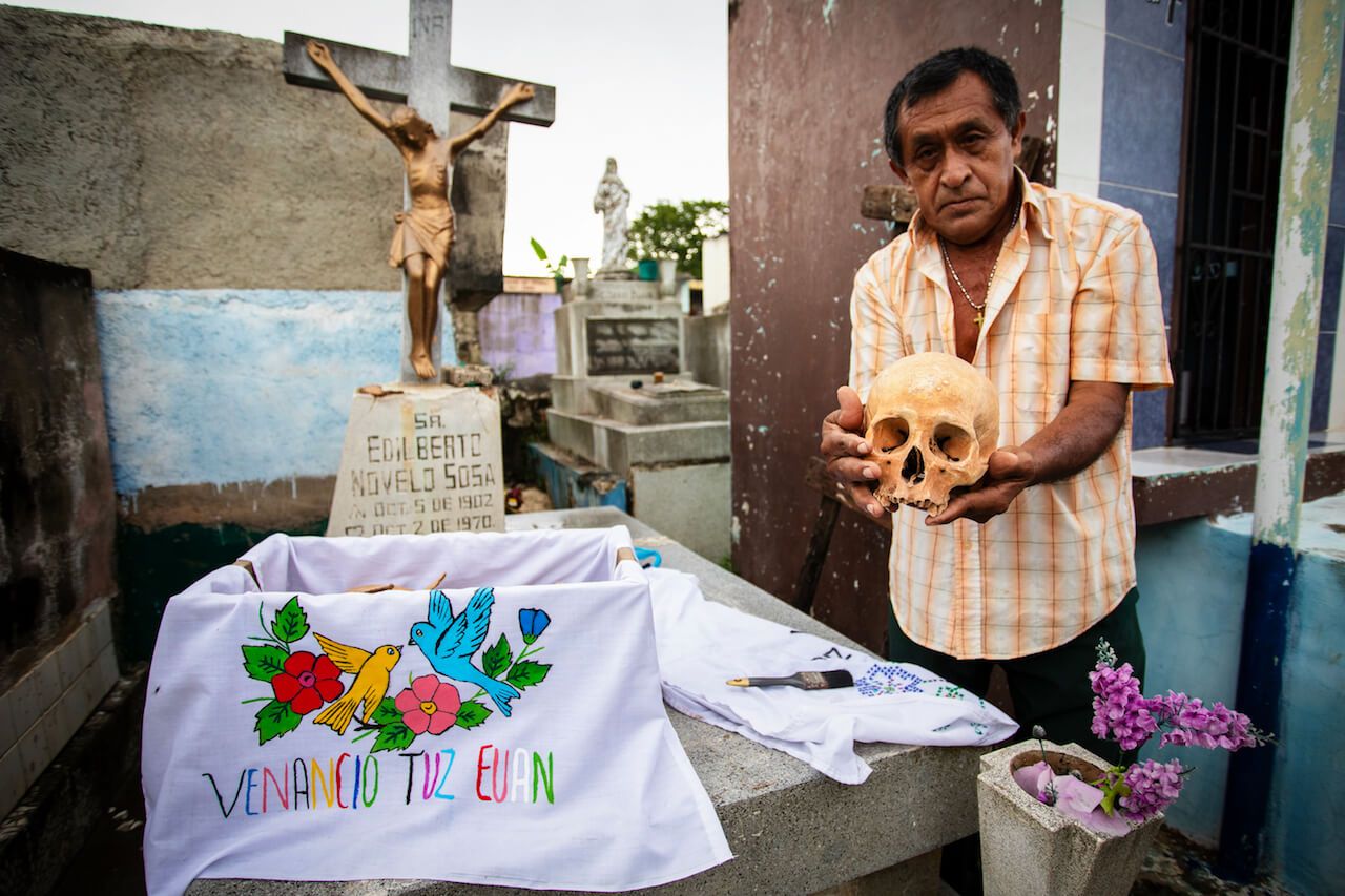 Don Venazio is showing the old Dia de Muertos tradition in Pomuch - cleaning and displaying bones of dead relatives.